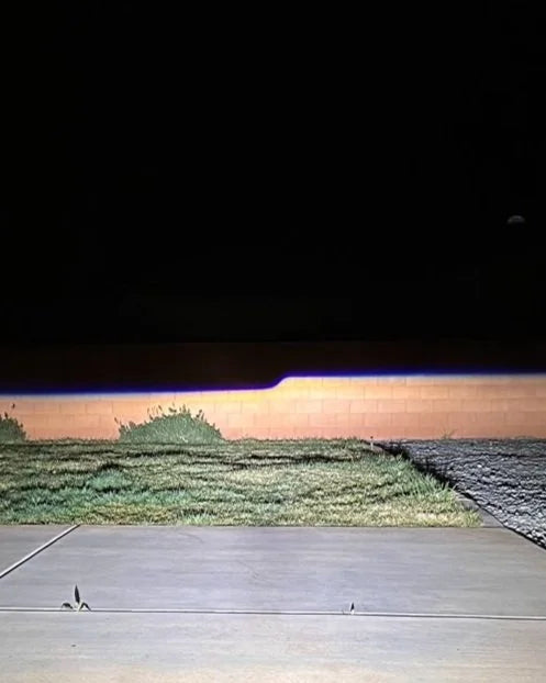 Aiming the headlights against a wall at night